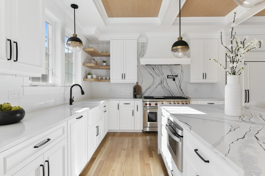 62 Brewster Drive Needham, MA 02492 - Photo 6 of 42 a kitchen with a sink dishwasher a stove and a refrigerator with wooden floor