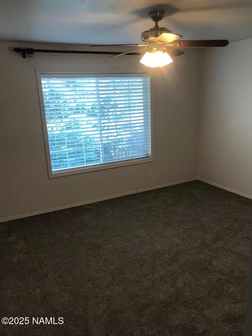 4045 South Lake Mary Road, Unit 5 Flagstaff, AZ 86005 - Photo 5 of 9 a view of a room that has a window in it