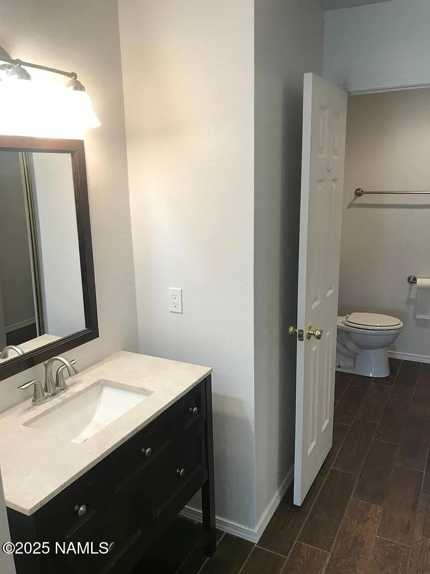 4045 South Lake Mary Road, Unit 5 Flagstaff, AZ 86005 - Photo 7 of 9 a bathroom with a sink and a mirror