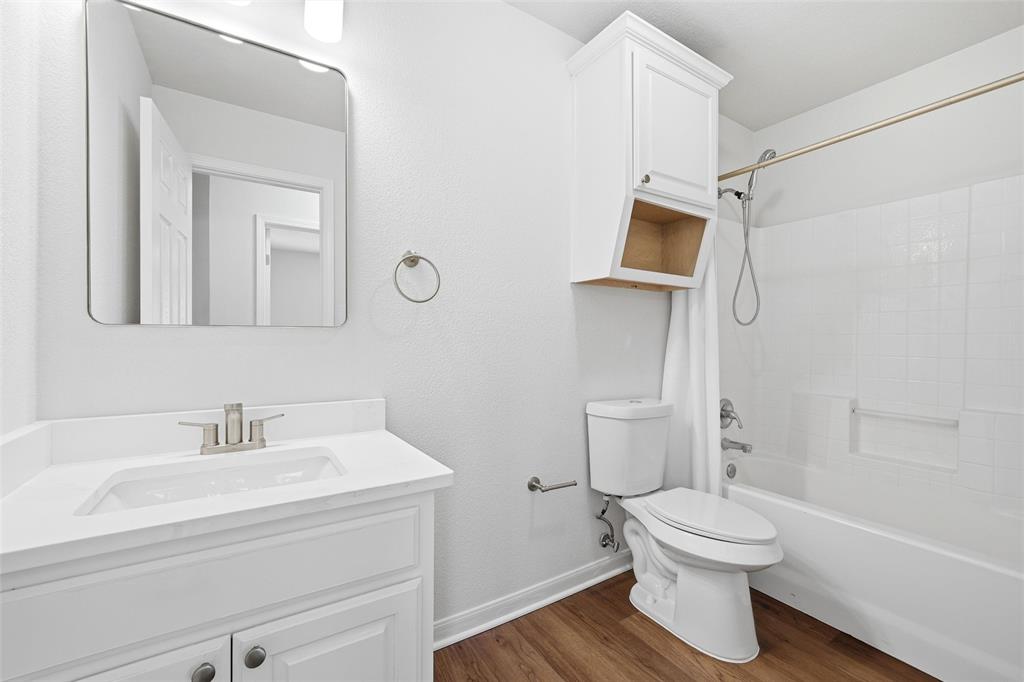 10124 Colony Drive Waco, TX 76708 - Photo 12 of 23 a bathroom with a toilet sink and shower