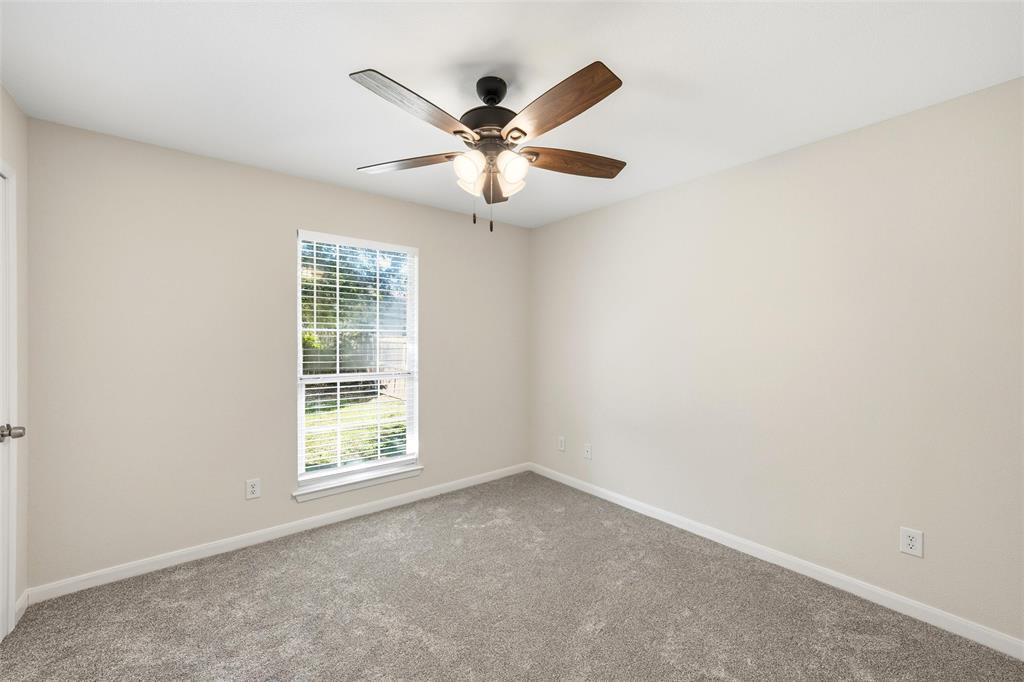 10124 Colony Drive Waco, TX 76708 - Photo 15 of 23 an empty room with windows and fan