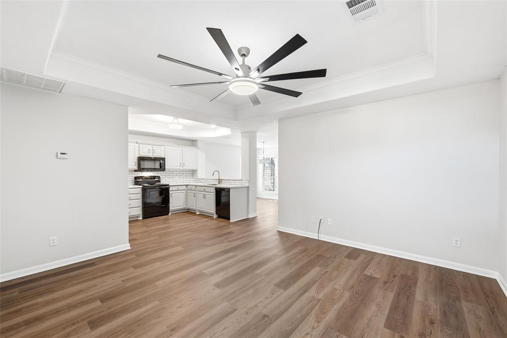 10124 Colony Drive Waco, TX 76708 - Photo 3 of 23 a view of a kitchen with a sink and cabinet with a ceiling fan