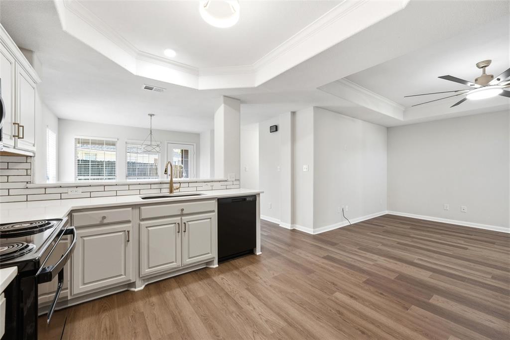 10124 Colony Drive Waco, TX 76708 - Photo 6 of 23 a large kitchen with granite countertop a stove top oven sink and cabinets