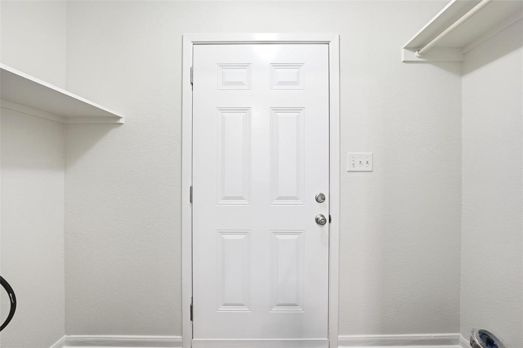 10124 Colony Drive Waco, TX 76708 - Photo 7 of 23 a bathroom with a granite countertop shower and a door