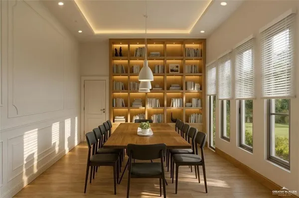 a view of a dining room with furniture and wooden floor