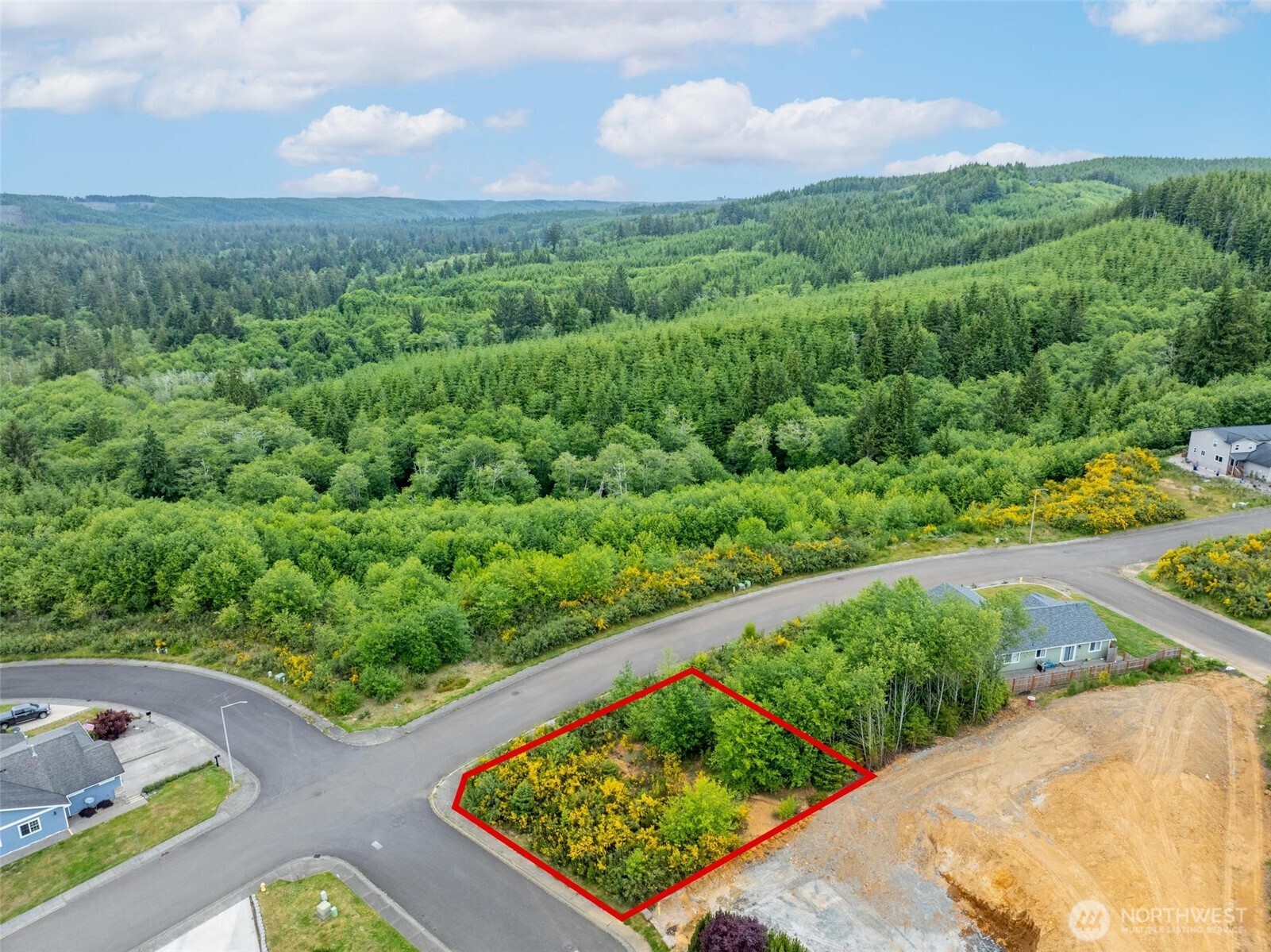 0 Sanderling Drive, Unit 1 Hoquiam, WA 98550 - Photo 11 of 15 a view of a garden with a couple of cars parked on the roadside
