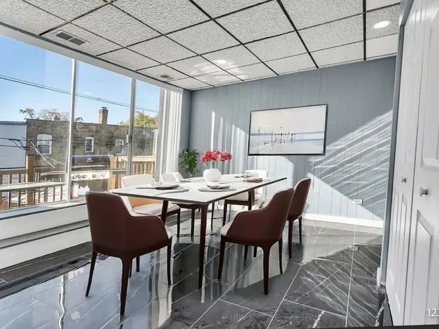 a view of a dining room with furniture window and outside view