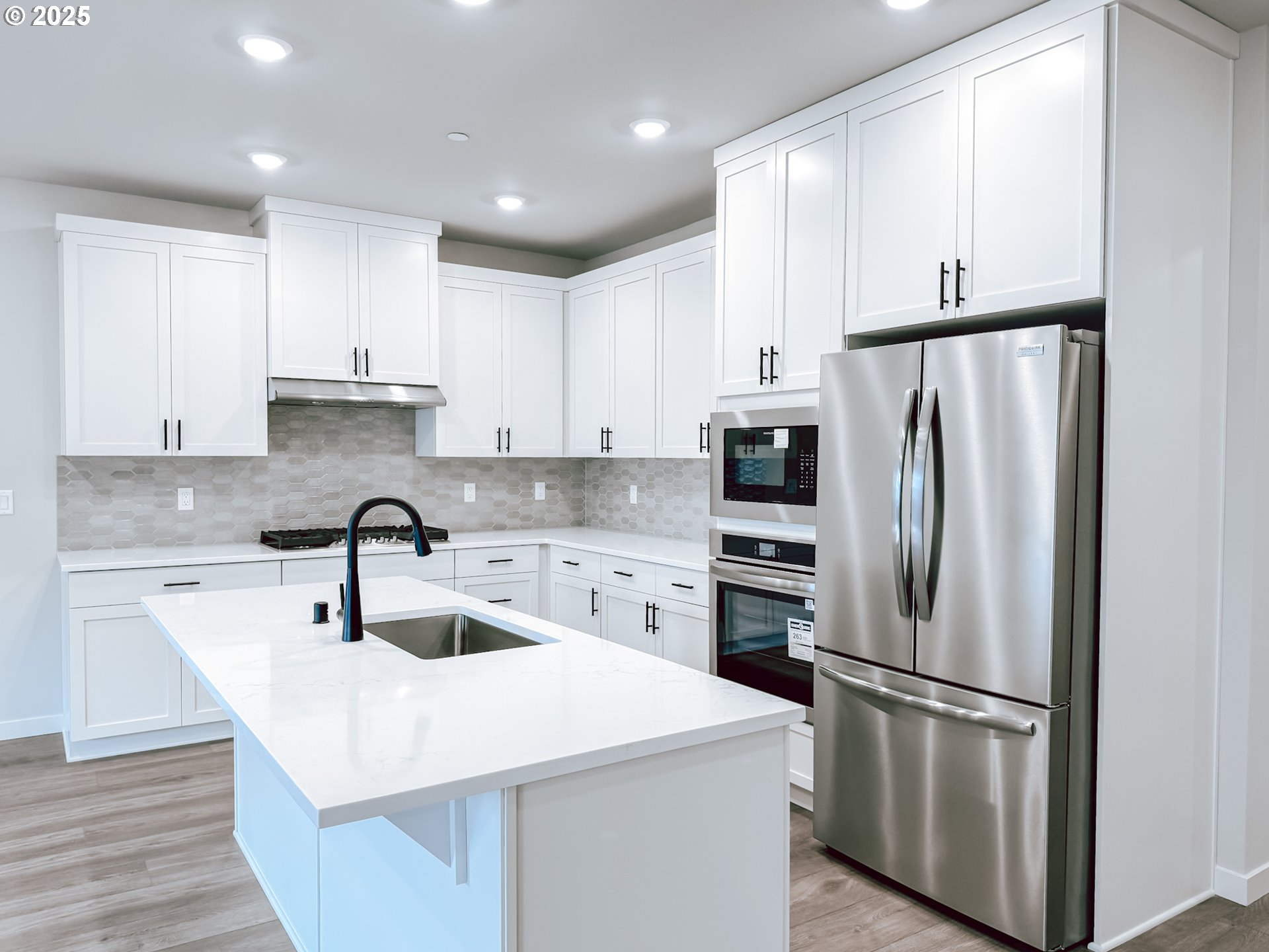 2603 South 6th Way Ridgefield, WA 98642 - Photo 32 of 41 a kitchen with stainless steel appliances a refrigerator sink and cabinets