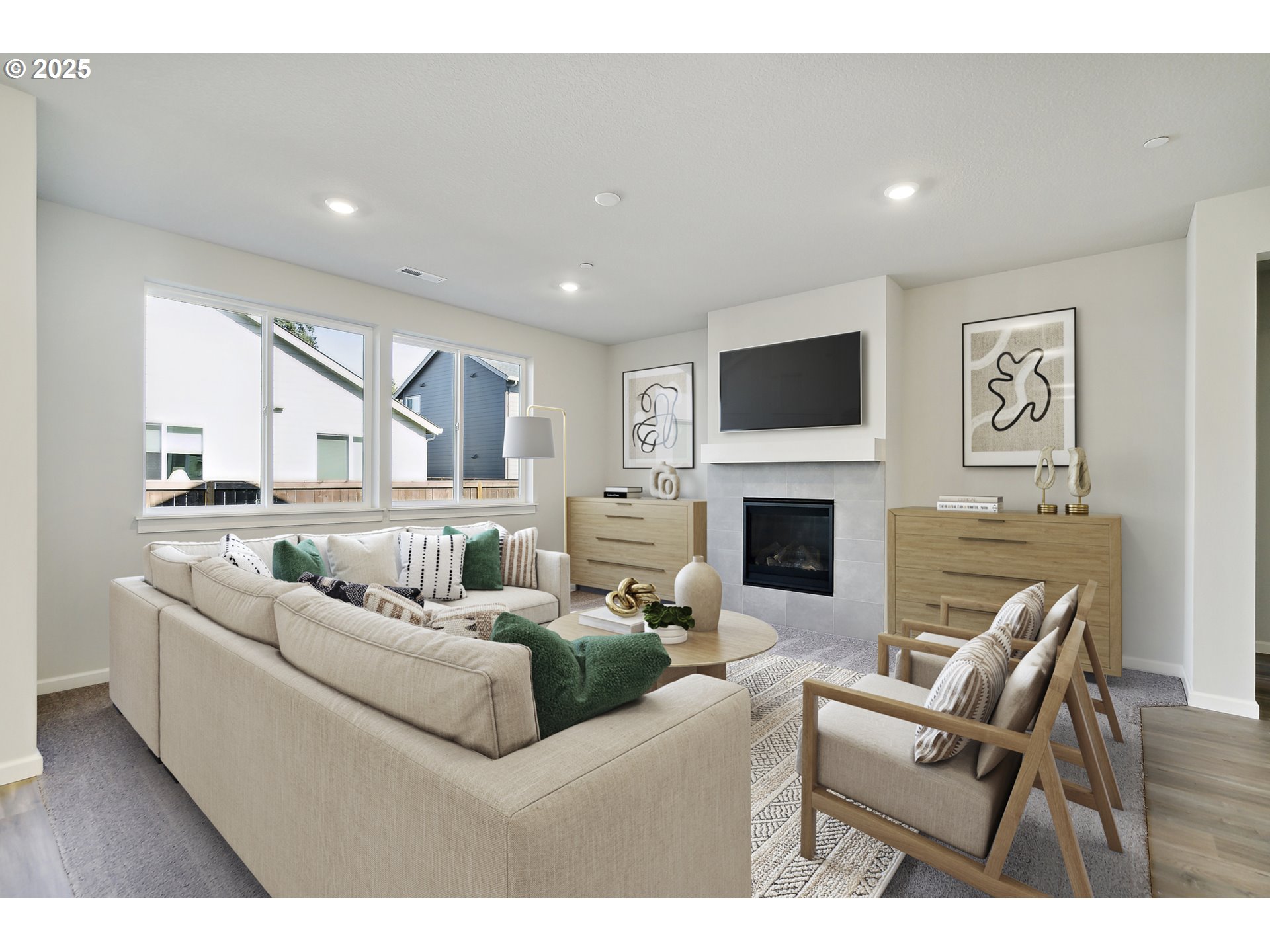 2603 South 6th Way Ridgefield, WA 98642 - Photo 5 of 41 a living room with furniture a flat screen tv and a fireplace