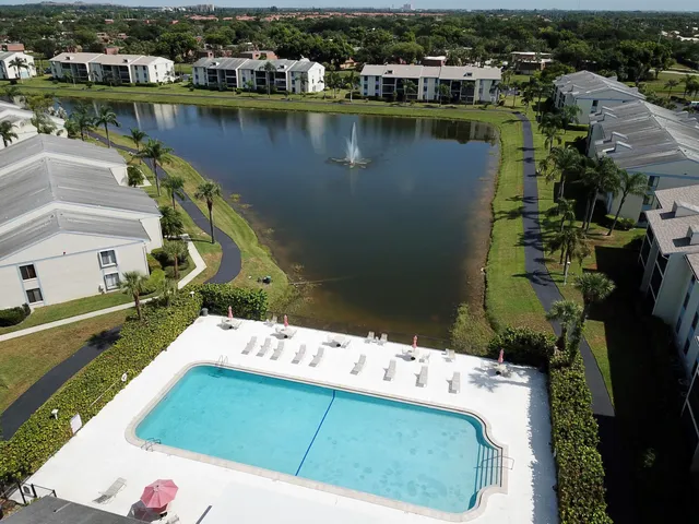 an aerial view of a house with a lake view