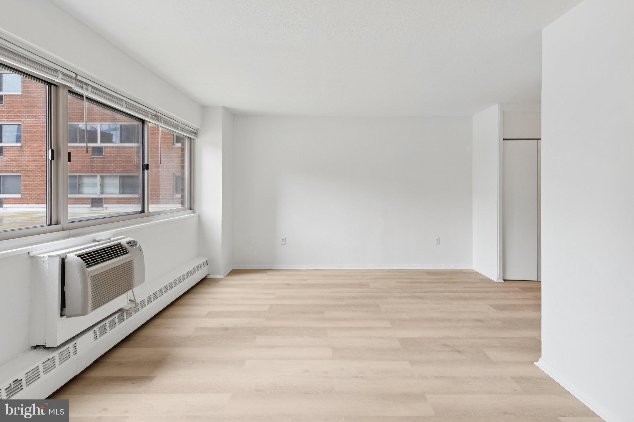 2101 Chestnut Street, Unit 324R Philadelphia, PA 19103 - Photo 5 of 21 a view of an empty room with a kitchen