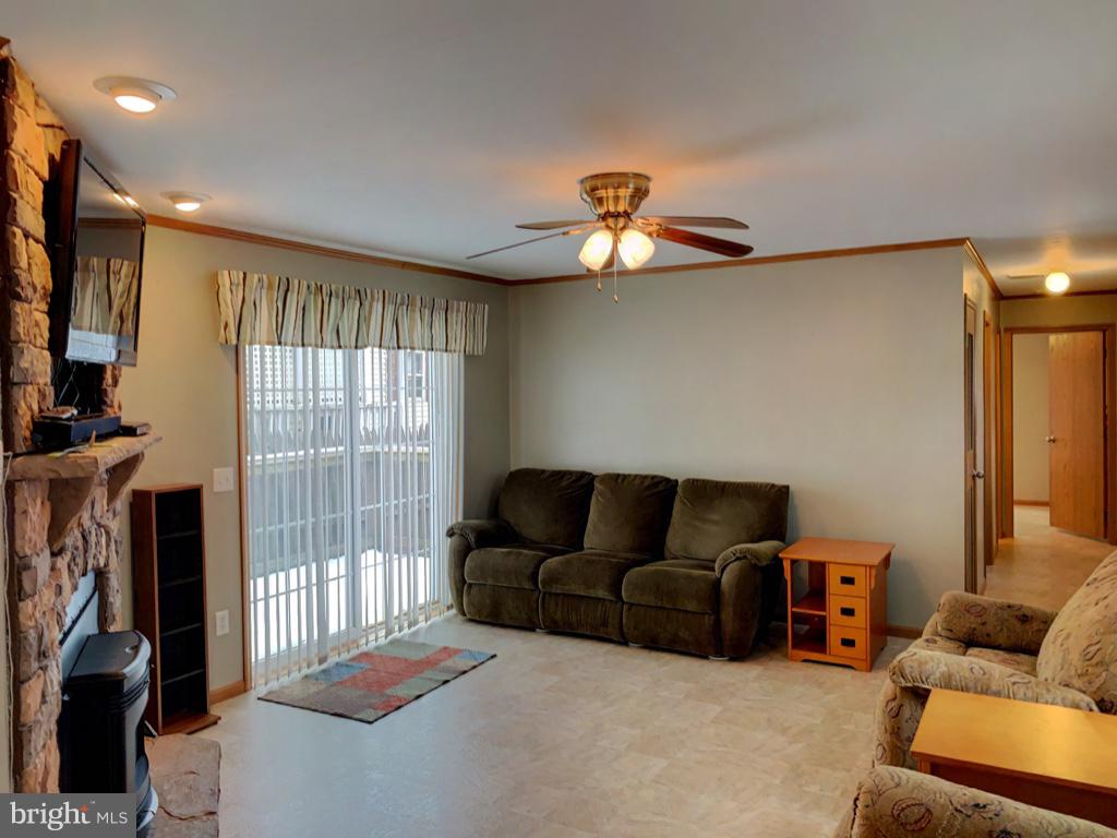 1340 Evering Avenue Rosedale, MD 21237 - Photo 5 of 34 a living room with furniture a ceiling fan and a window