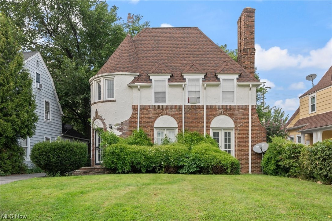 17027 Kenyon Road Cleveland, OH 44120 - Photo 1 of 20 View of front facade with a front lawn