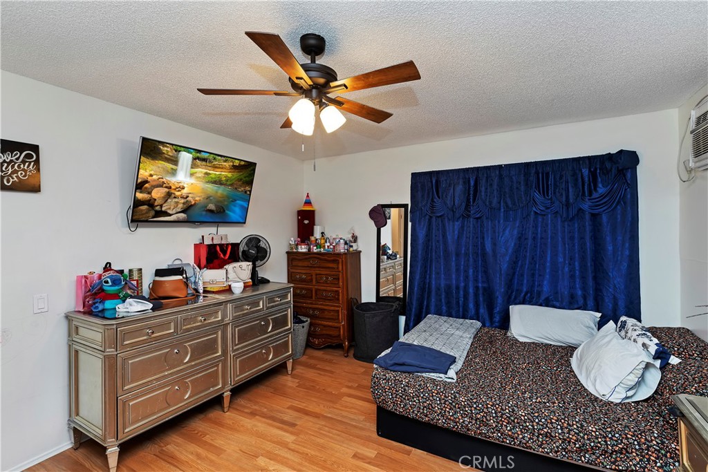 2989 Canyon Crest Drive Riverside, CA 92507 - Photo 39 of 41 a living room with furniture and a flat screen tv