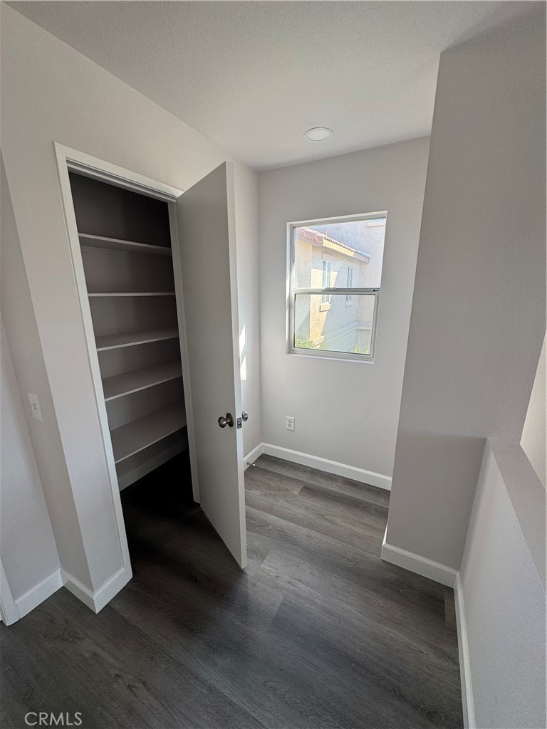 39790-39790 Monarch Drive Murrieta, CA 92563 - Photo 12 of 22 an empty room with wooden floor and window