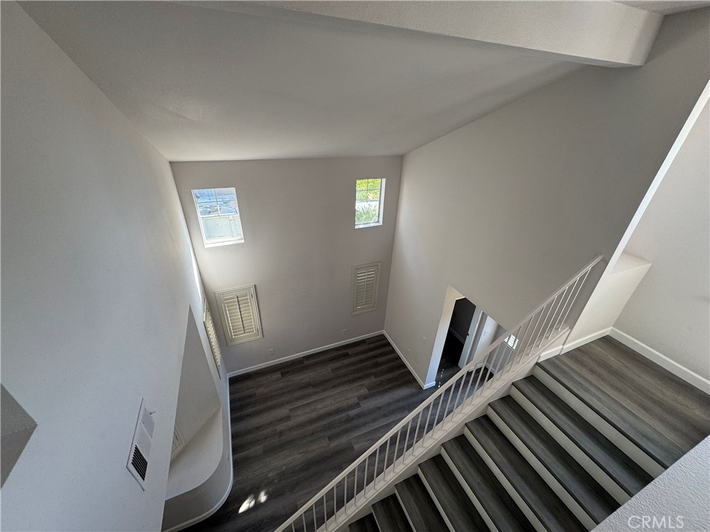 39790-39790 Monarch Drive Murrieta, CA 92563 - Photo 15 of 22 a view of an empty room with wooden floor