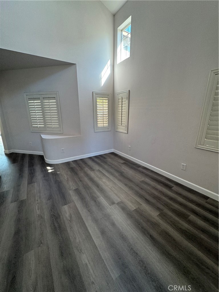 39790-39790 Monarch Drive Murrieta, CA 92563 - Photo 17 of 22 an empty room with wooden floor and windows