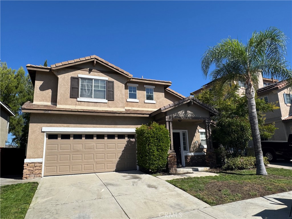 39790-39790 Monarch Drive Murrieta, CA 92563 - Photo 2 of 22 a front view of a house with a yard