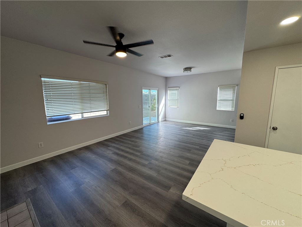 39790-39790 Monarch Drive Murrieta, CA 92563 - Photo 4 of 22 a view of an empty room with wooden floor and a window