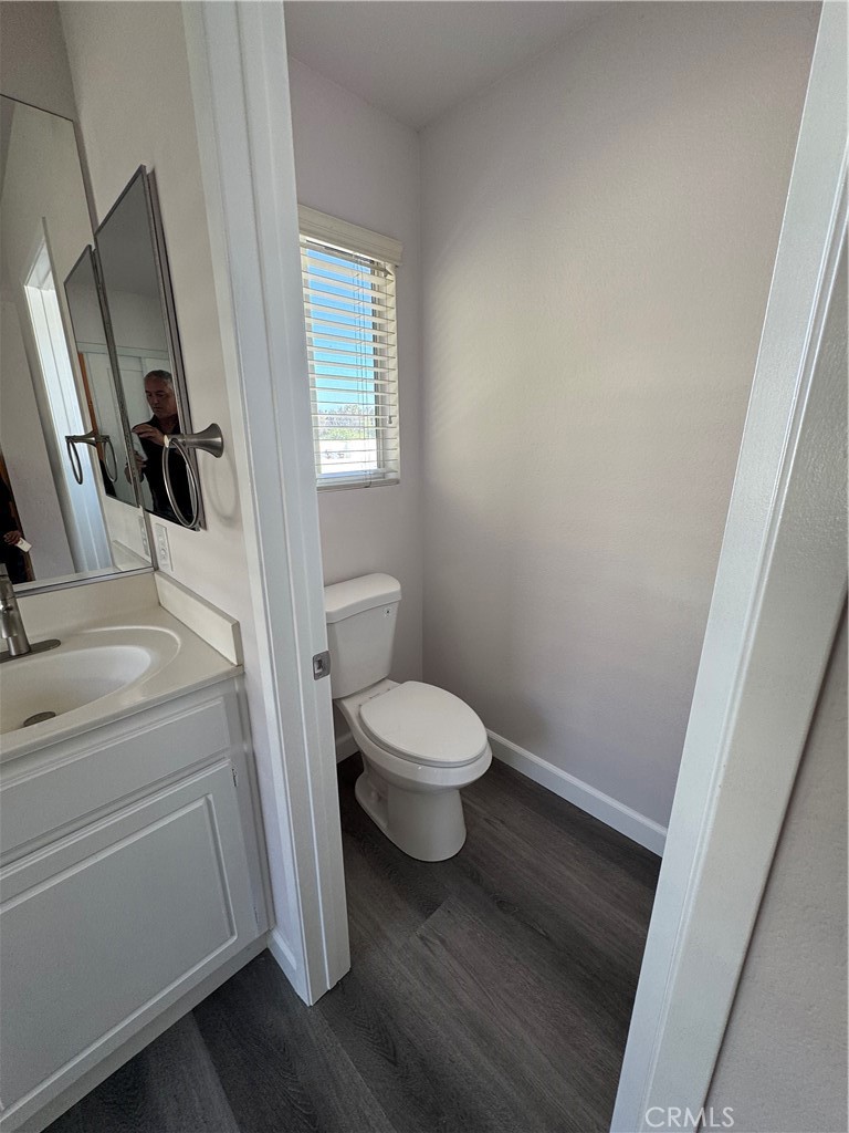 39790-39790 Monarch Drive Murrieta, CA 92563 - Photo 9 of 22 a bathroom with a toilet sink and a mirror