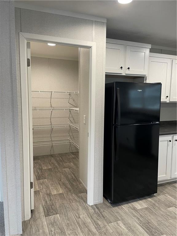 1322 Hidden Valley Road Bulger, PA 15019 - Photo 5 of 14 a view of a refrigerator in kitchen and white cabinets