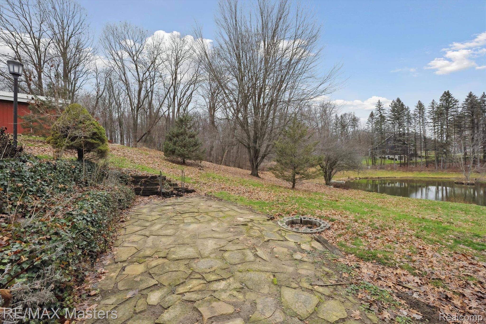 4845 Maple Lane Road Rives Junction, MI 49277 - Photo 49 of 68 Lower Patio Overlooks Pond