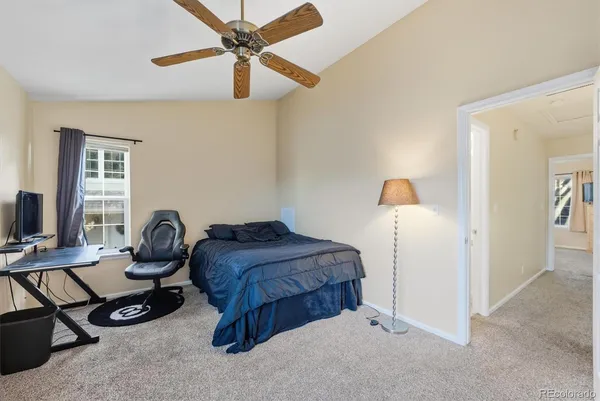 a bedroom with furniture and a window