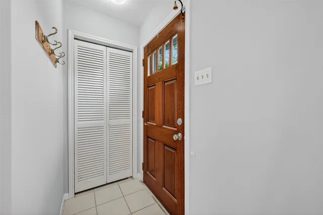 wooden floor in an empty room with a fireplace