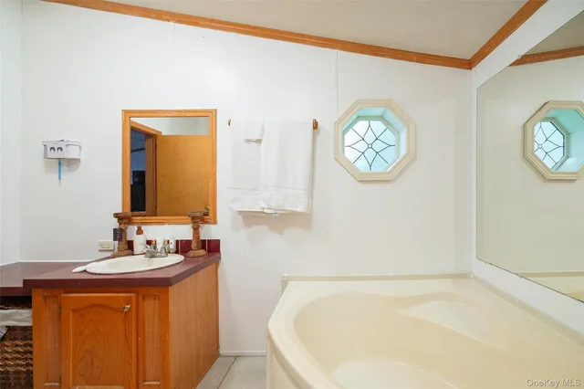 a bathroom with a bathtub and a sink