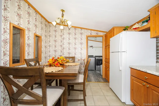 a view of a dining room with furniture and window