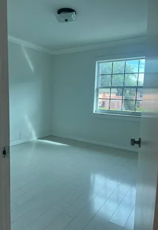 view of an empty room with a window