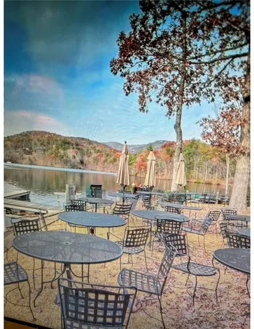 swimming pool view with a outdoor seating space