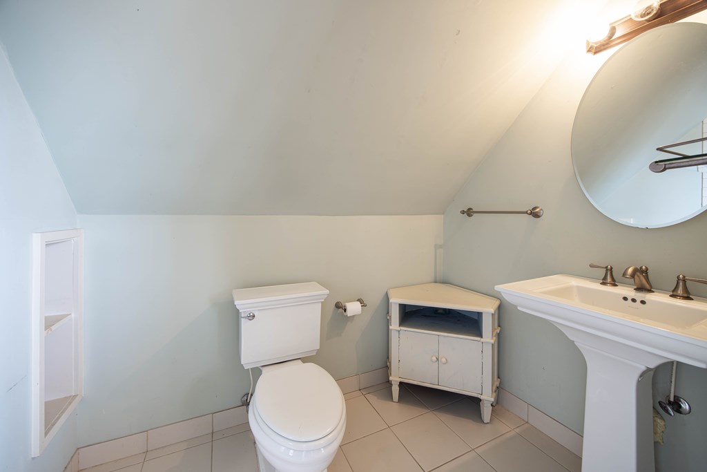 1620 Springer Street Columbus, GA 31901 - Photo 15 of 41 a bathroom with a toilet sink and mirror