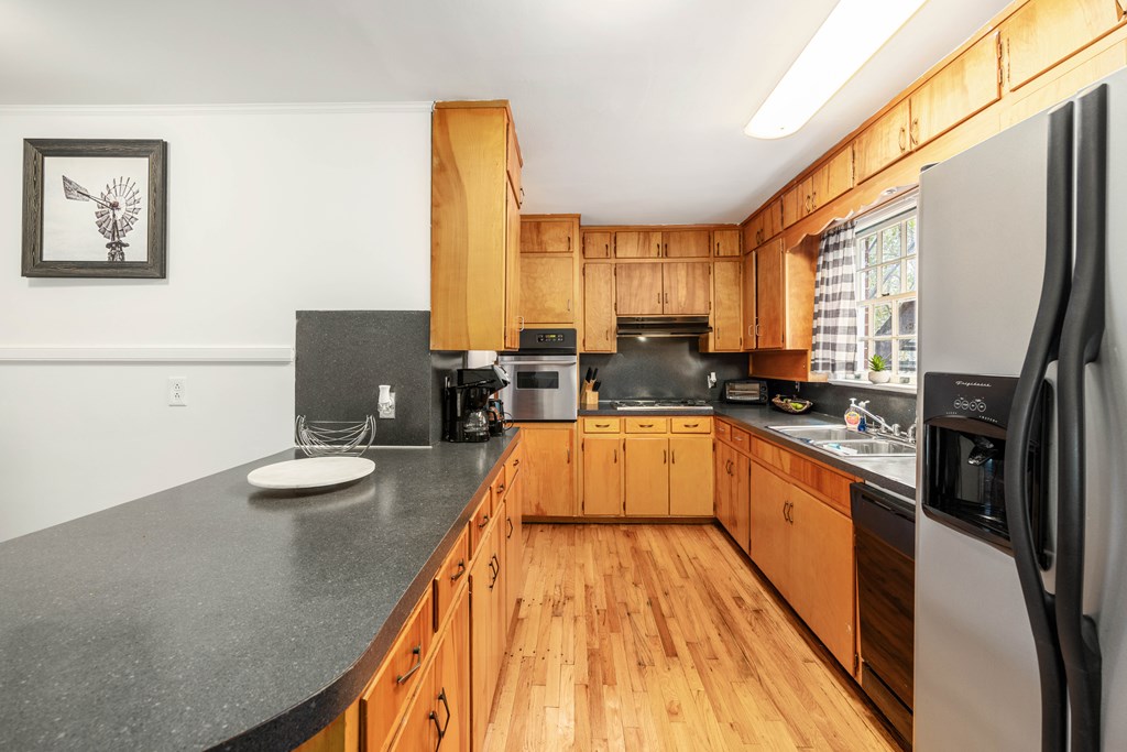 1620 Springer Street Columbus, GA 31901 - Photo 20 of 41 a large kitchen with sink a refrigerator and window