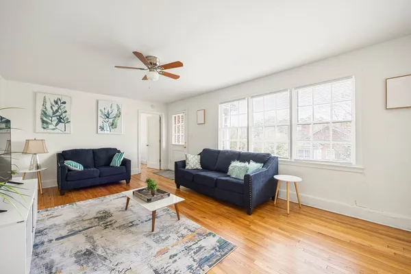 a living room with furniture and a window
