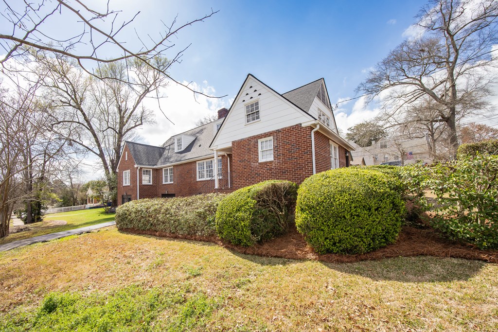 1620 Springer Street Columbus, GA 31901 - Photo 6 of 41 a front view of a house with a yard and garage