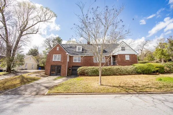 a front view of a house with a yard