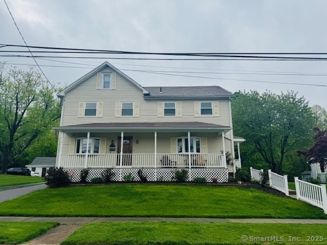 a view of a house with a backyard