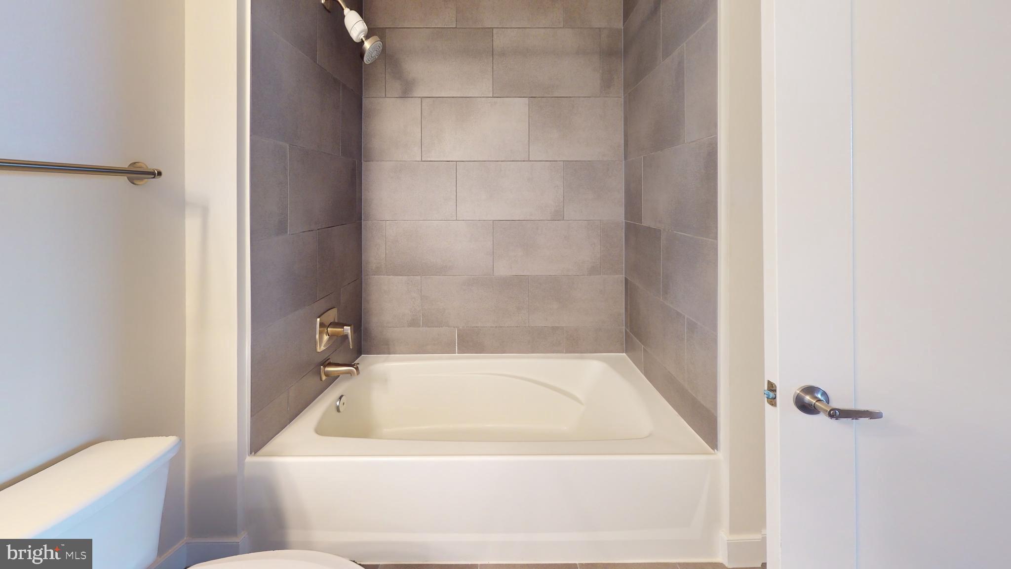 50 Florida Avenue Northeast, Unit 823 Washington, DC 20002 - Photo 11 of 12 a bathroom with a bathtub