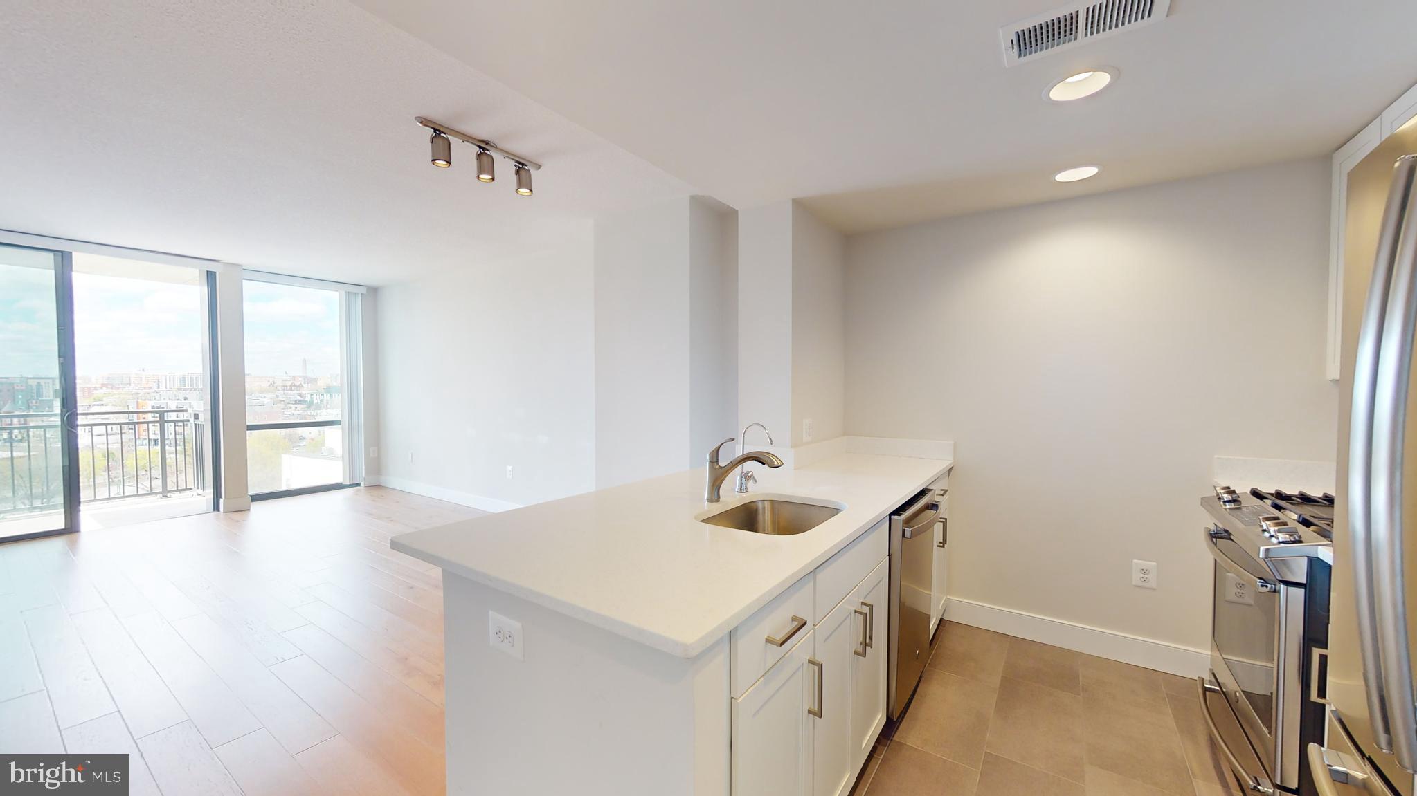 50 Florida Avenue Northeast, Unit 823 Washington, DC 20002 - Photo 3 of 12 a bathroom with a sink and a vanity