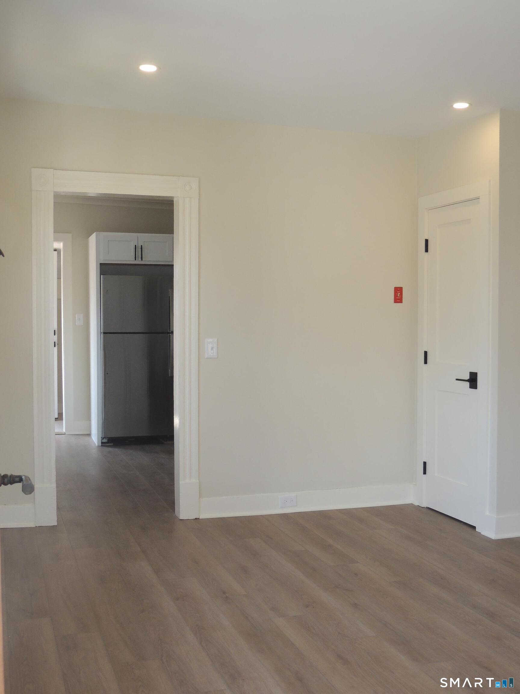 56-58 Harrison Avenue, Unit 2 Branford, CT 06405 - Photo 13 of 39 Living room opens to kitchen