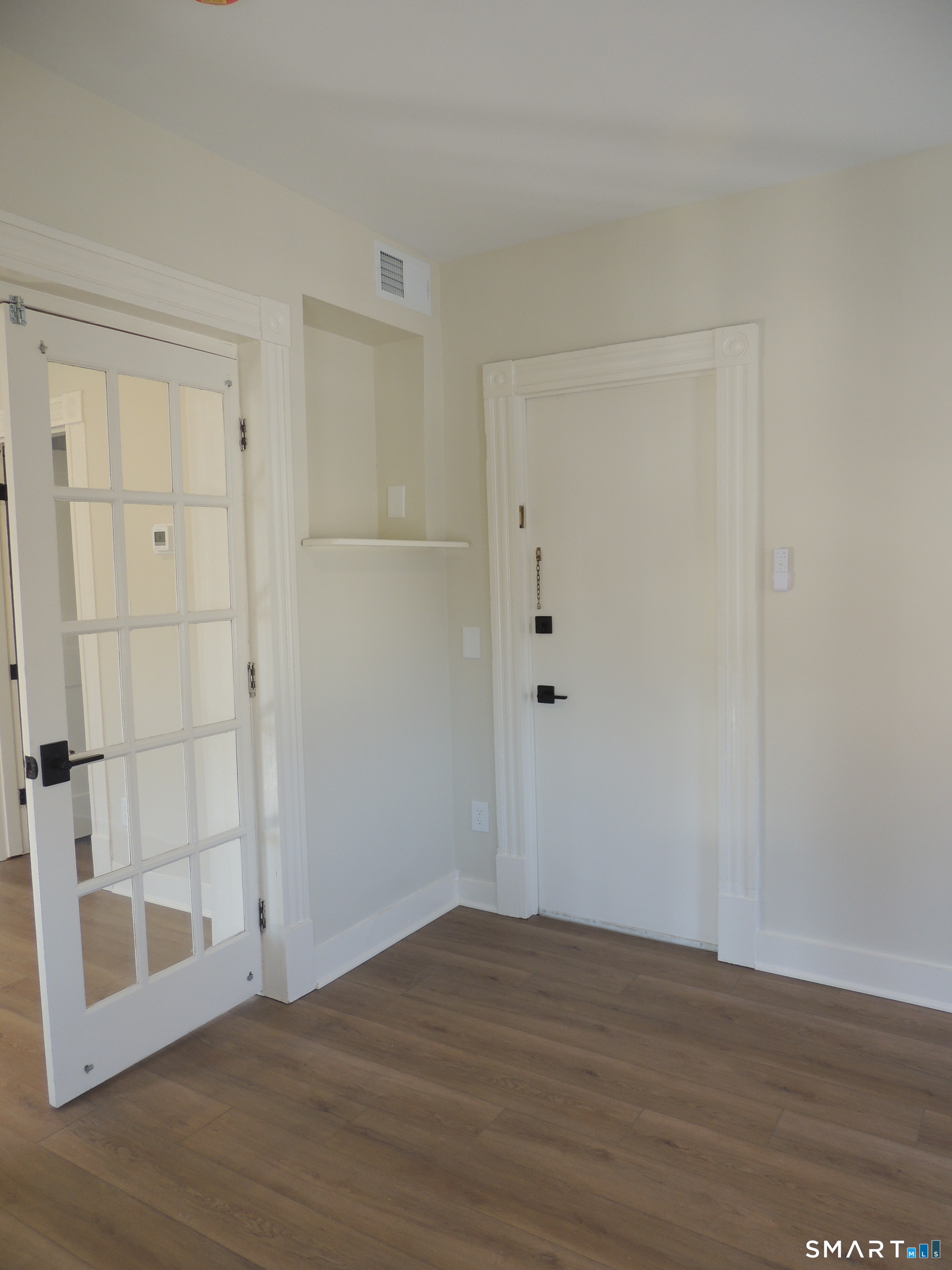 56-58 Harrison Avenue, Unit 2 Branford, CT 06405 - Photo 22 of 39 a view of an empty room with wooden floor