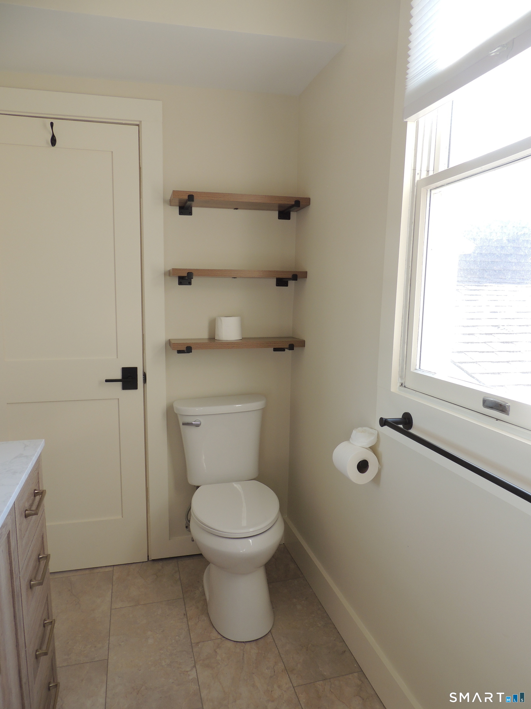 56-58 Harrison Avenue, Unit 2 Branford, CT 06405 - Photo 24 of 39 a bathroom with a toilet and a shower