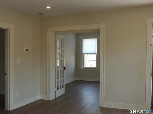 a bathroom with a shower sink and mirror