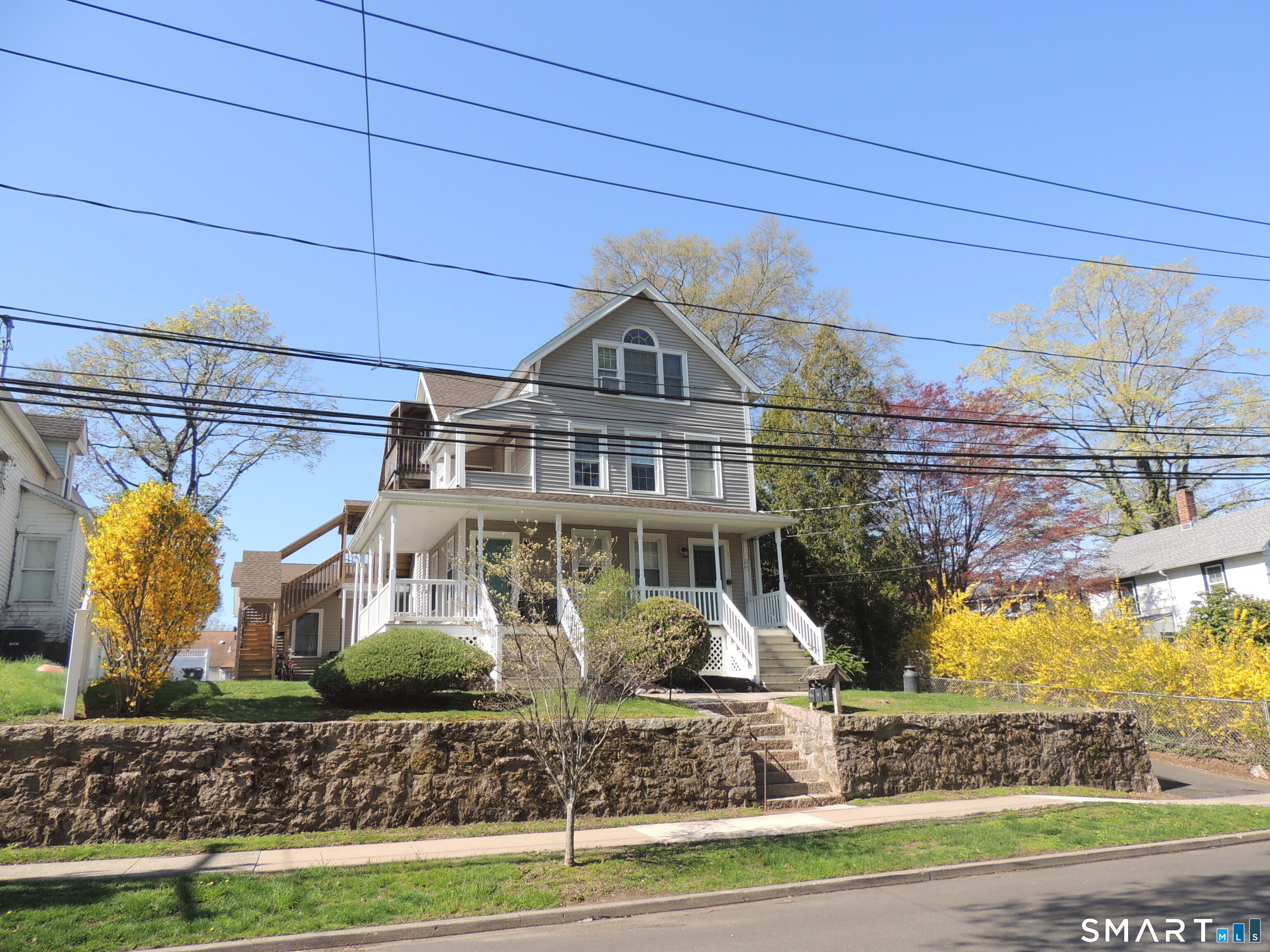 56-58 Harrison Avenue, Unit 2 Branford, CT 06405 - Photo 3 of 39 a front view of a house with garden