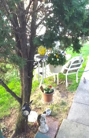 a view of a chair and table in the balcony