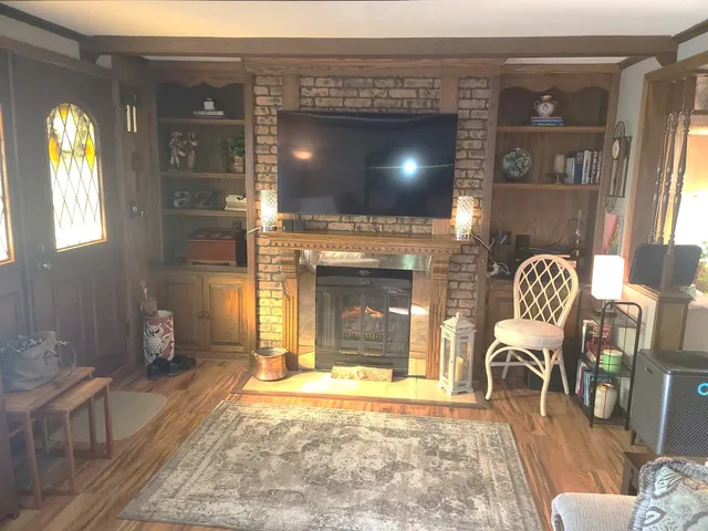 a living room with a couch and a fireplace