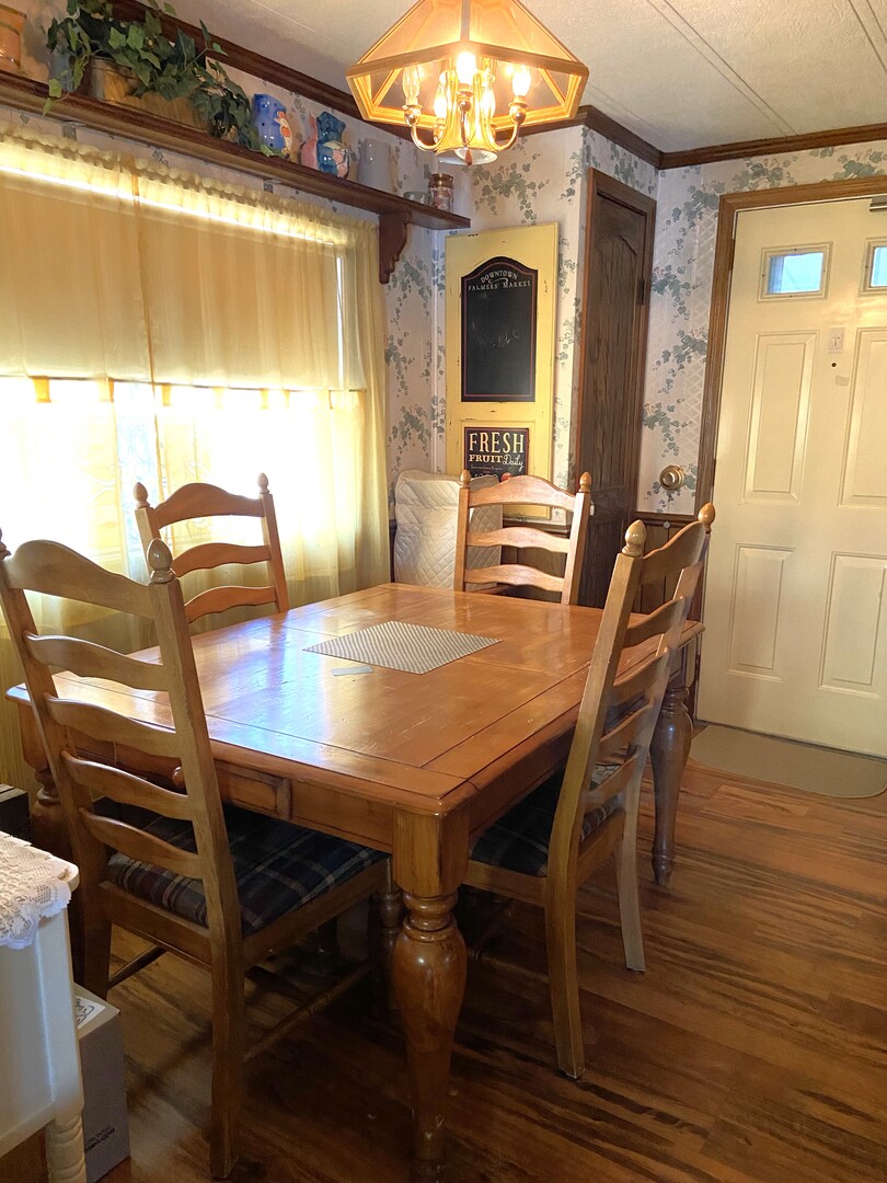 6801 South La Grange Road Hodgkins, IL 60525 - Photo 5 of 26 a view of a dining room with furniture and wooden floor
