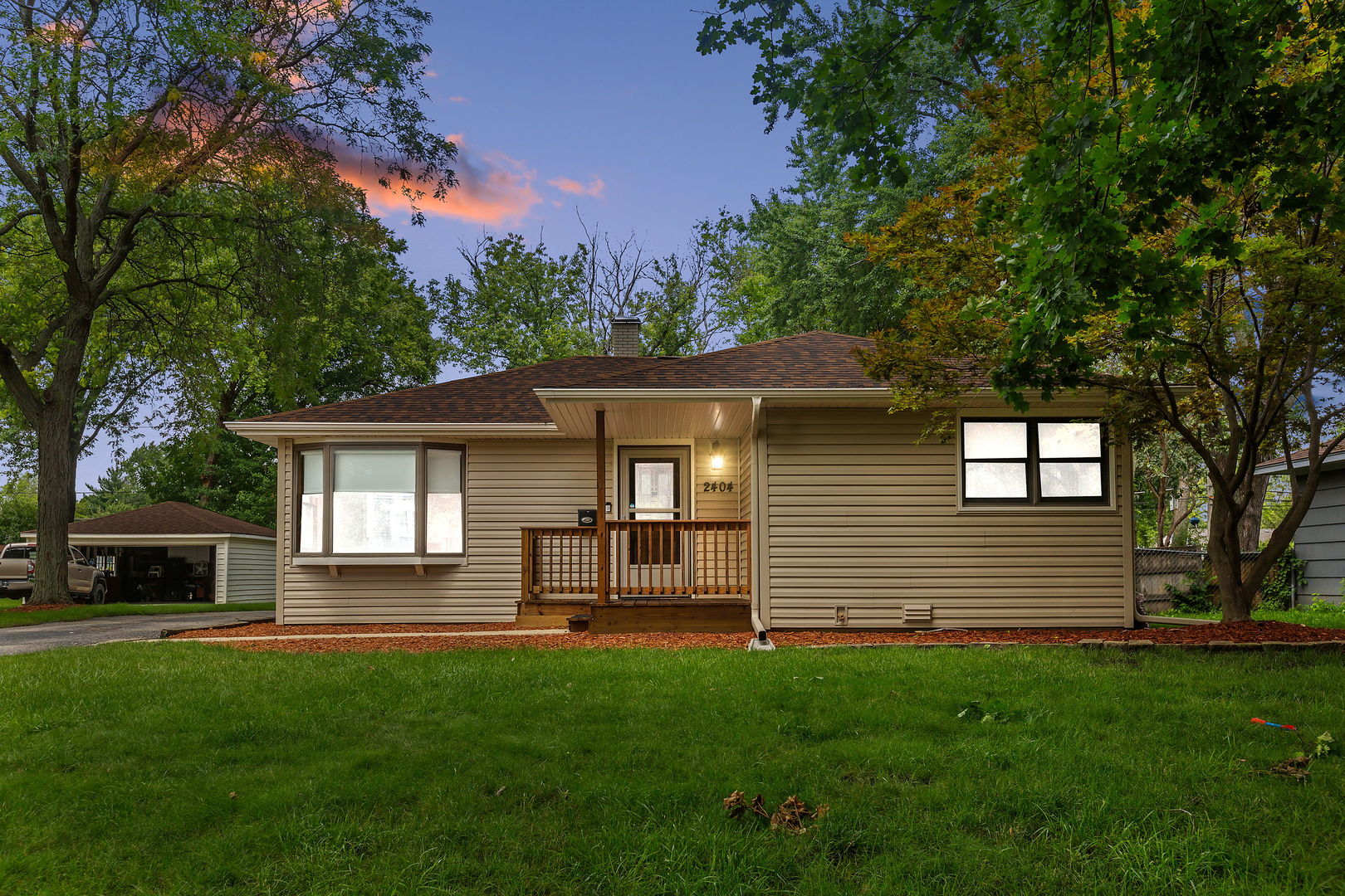 2404 George Street Rolling Meadows, IL 60008 - Photo 1 of 27 a front view of a house with a yard