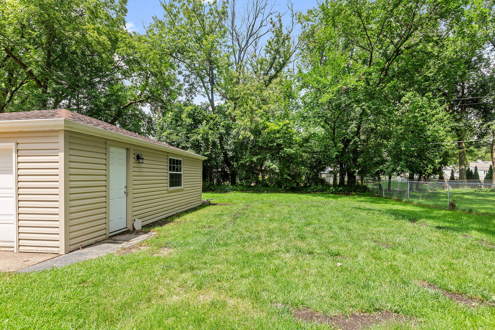 2404 George Street Rolling Meadows, IL 60008 - Photo 23 of 27 a view of a backyard with large trees